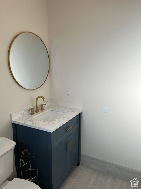 Bathroom with vanity and toilet