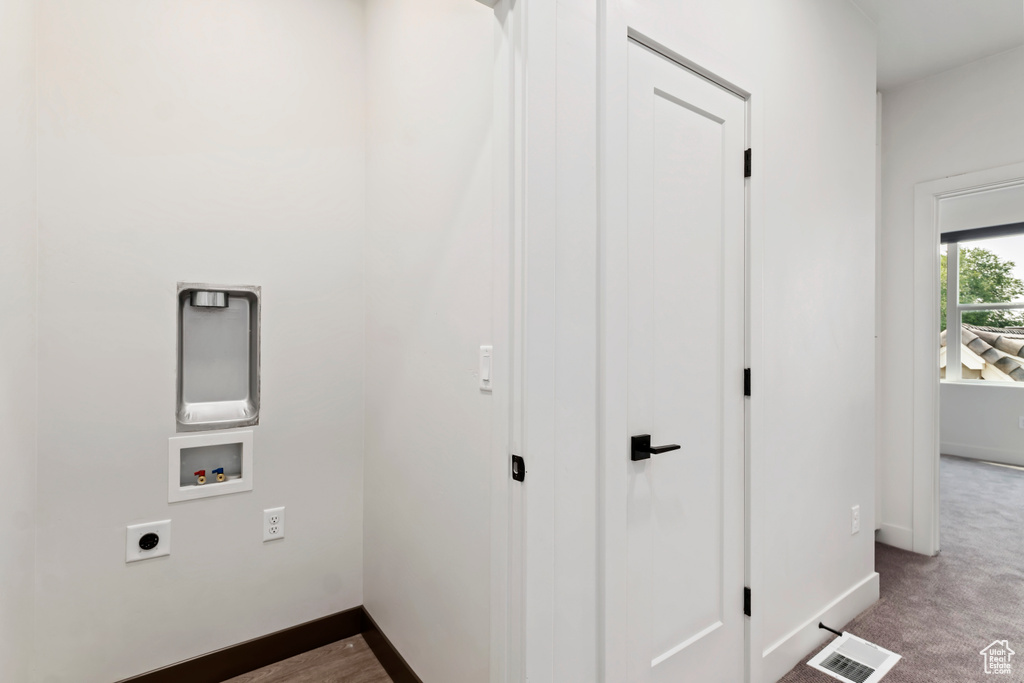 Laundry area featuring washer hookup, hookup for an electric dryer, and baseboards