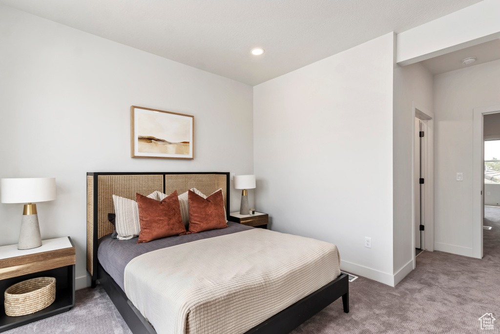 Carpeted bedroom with baseboards