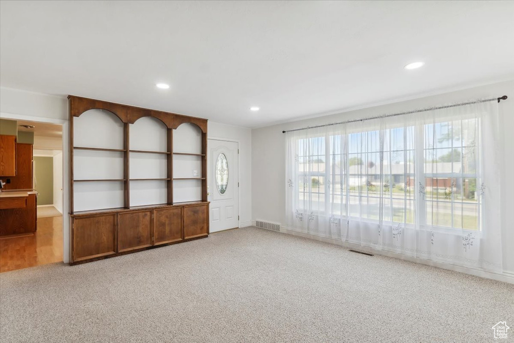 Spare room featuring recessed lighting, carpet flooring, and baseboards