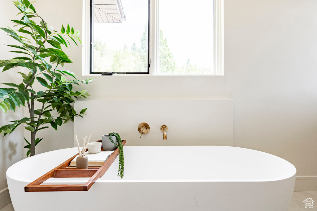 Full bathroom featuring a freestanding bath