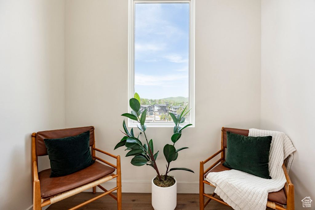 Sitting room featuring baseboards and wood finished floors