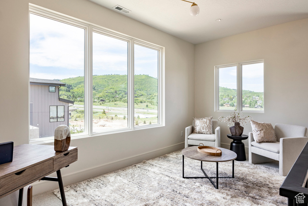 Living room with plenty of natural light and baseboards