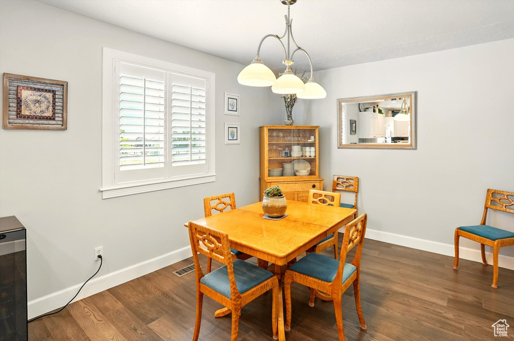 Dining room with baseboards and wood finished floors