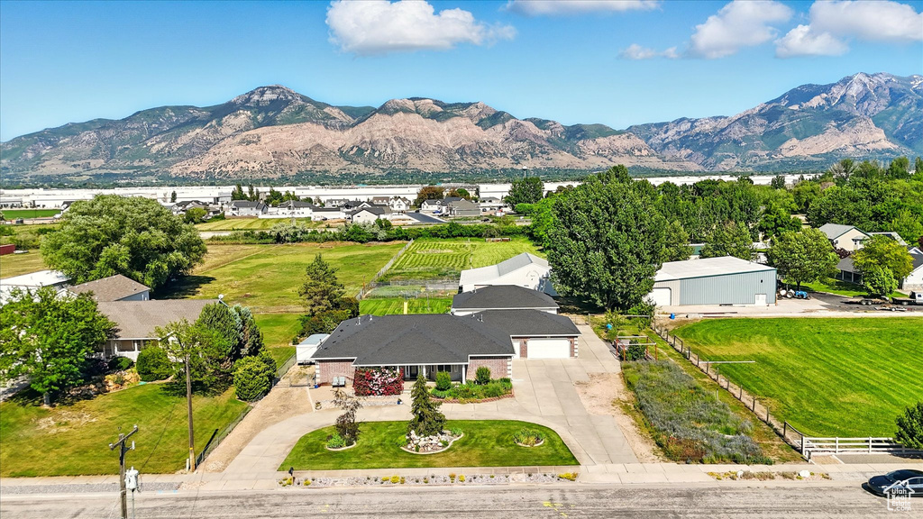 Aerial perspective of suburban area with a mountain backdrop