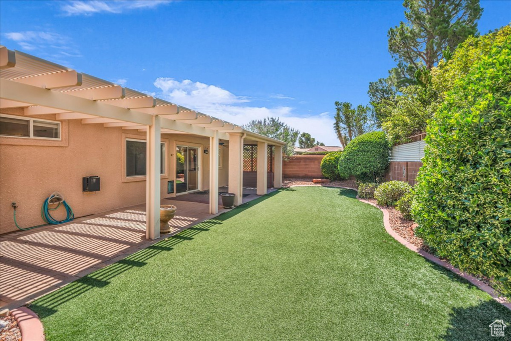 View of yard featuring a pergola and a patio area
