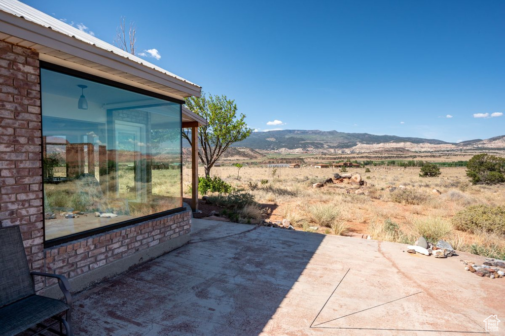 View of patio with a mountain view