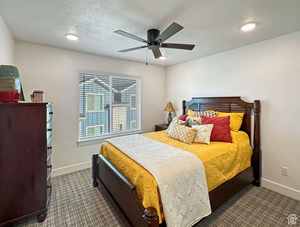 Bedroom with baseboards, carpet, ceiling fan, a textured ceiling, and recessed lighting