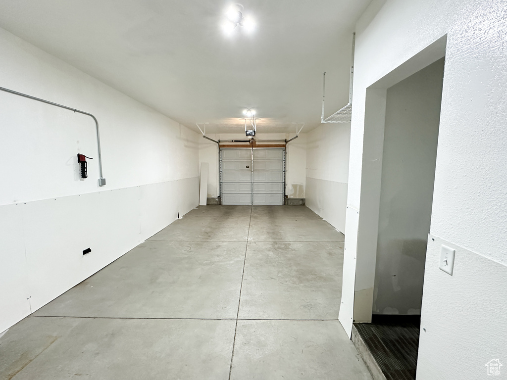 Garage featuring a garage door opener
