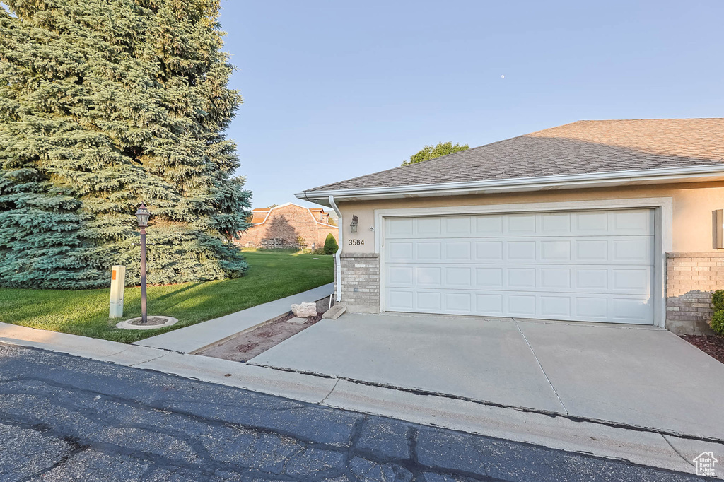 Garage featuring driveway
