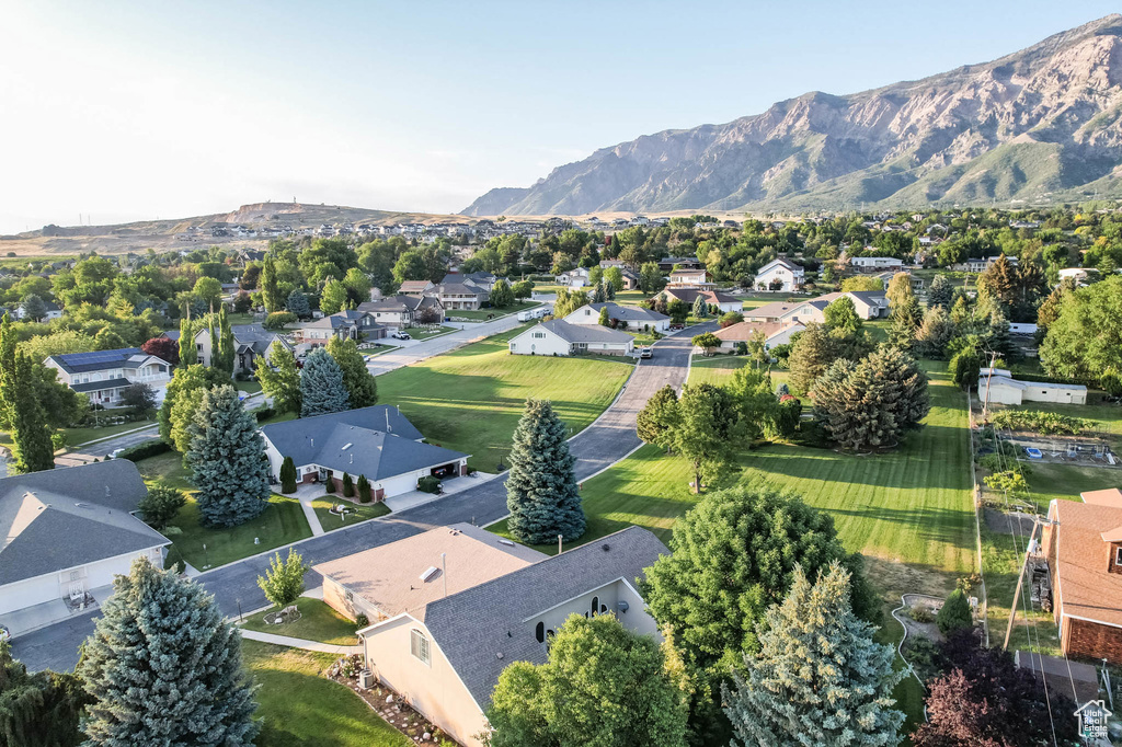 Aerial perspective of suburban area with a mountain backdrop