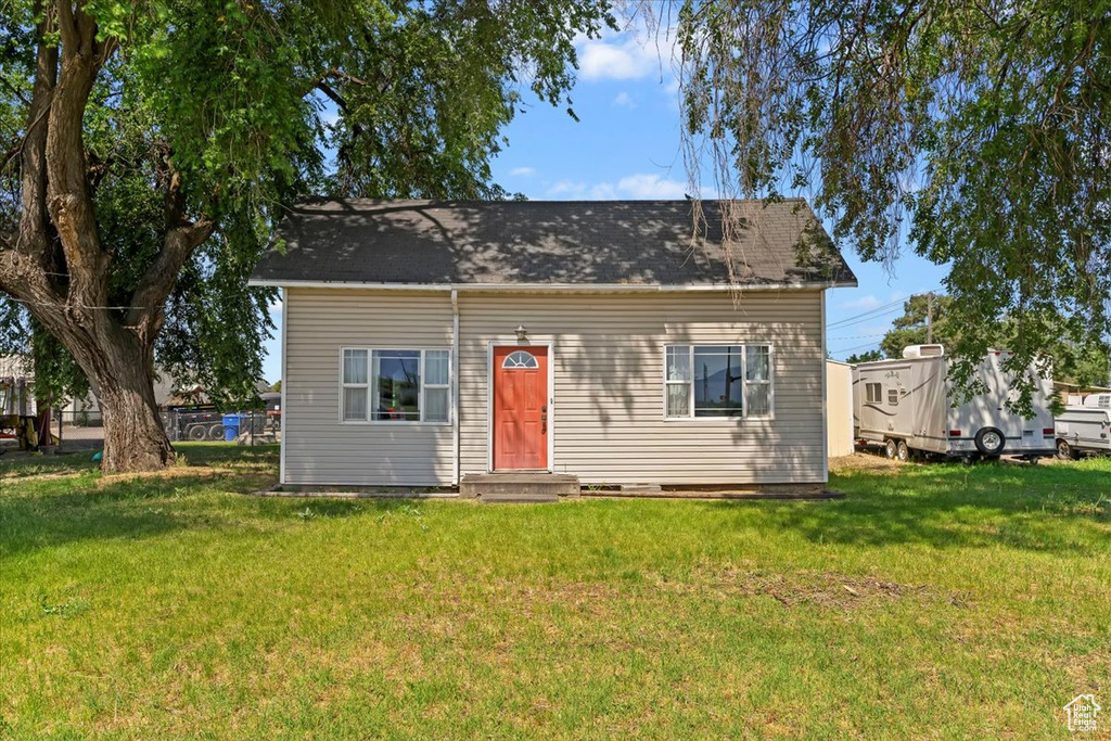 Bungalow-style home featuring a front lawn