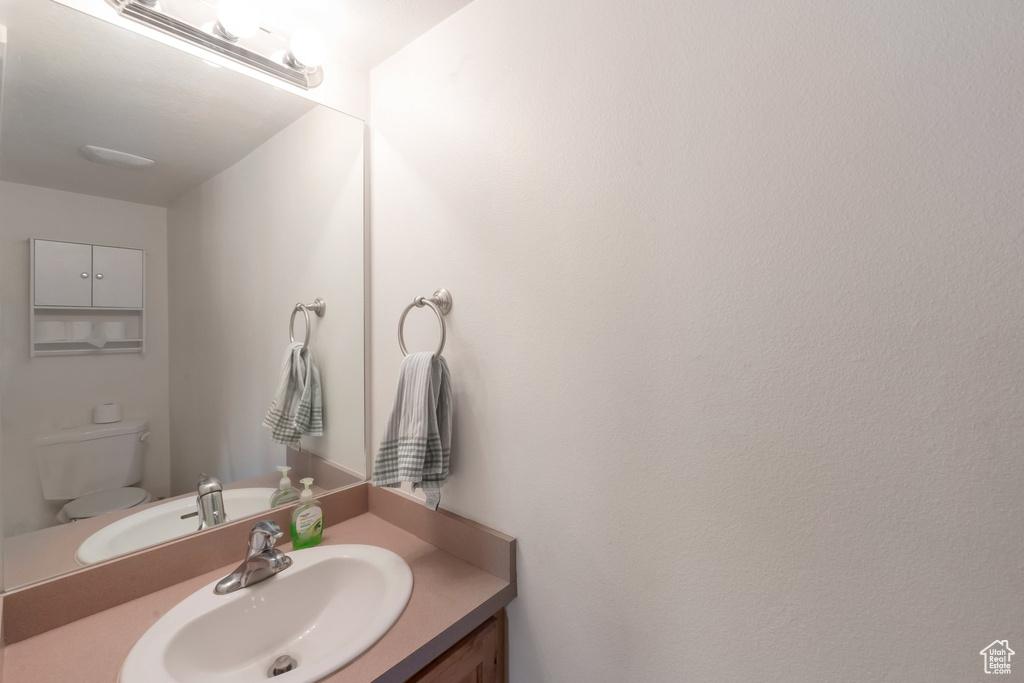 Bathroom with vanity and toilet