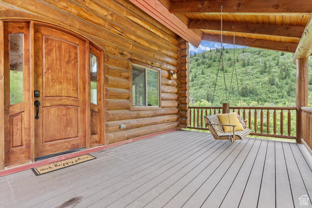 Wooden terrace with a view of trees