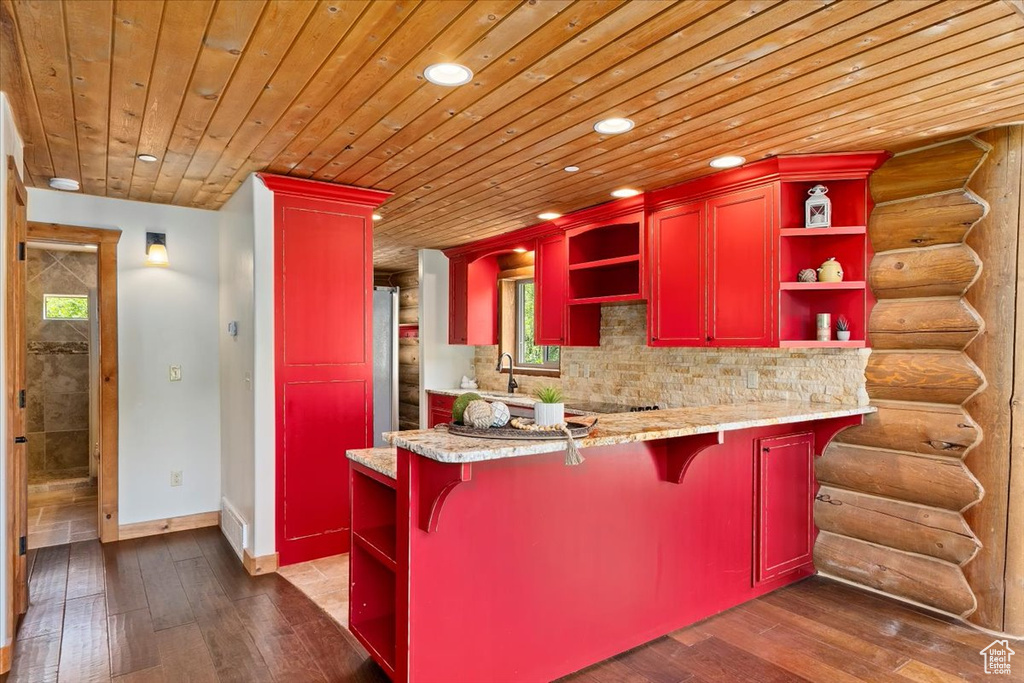 Kitchen with open shelves, red cabinets, recessed lighting, dark wood-style flooring, and wood ceiling