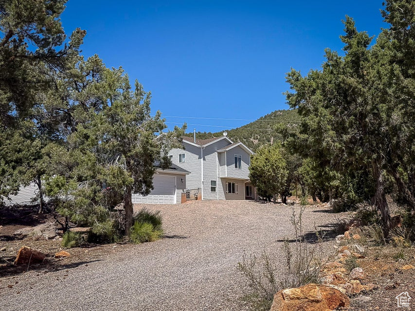 View of property hidden behind natural elements