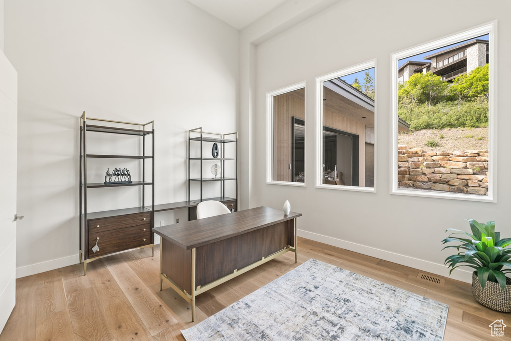Office area featuring light wood finished floors and baseboards