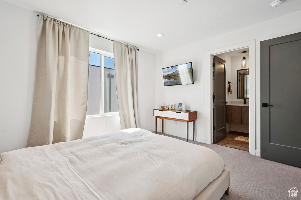 Bedroom featuring carpet floors, recessed lighting, ensuite bathroom, and baseboards