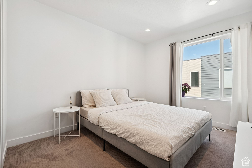 Bedroom featuring carpet floors, recessed lighting, and baseboards