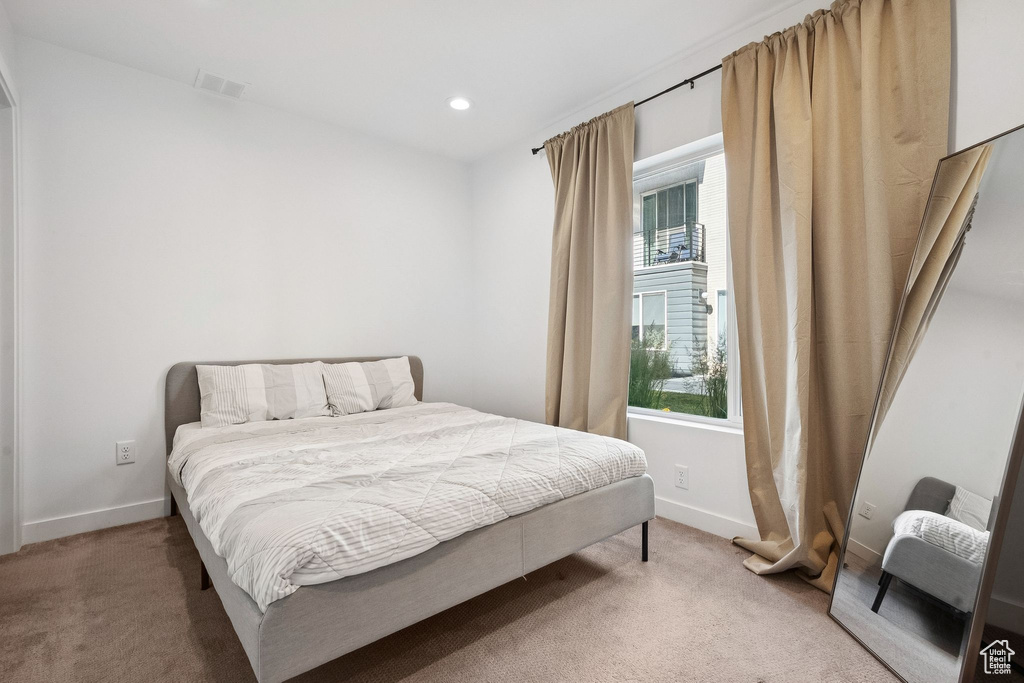 Bedroom featuring carpet floors, baseboards, and recessed lighting
