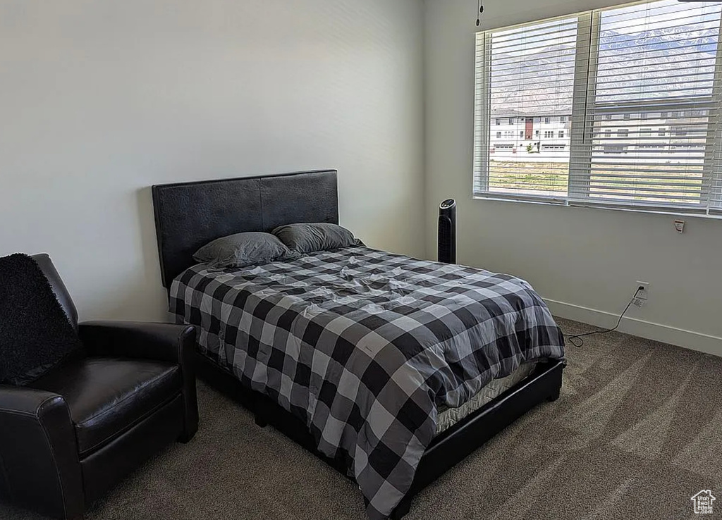Carpeted bedroom with baseboards