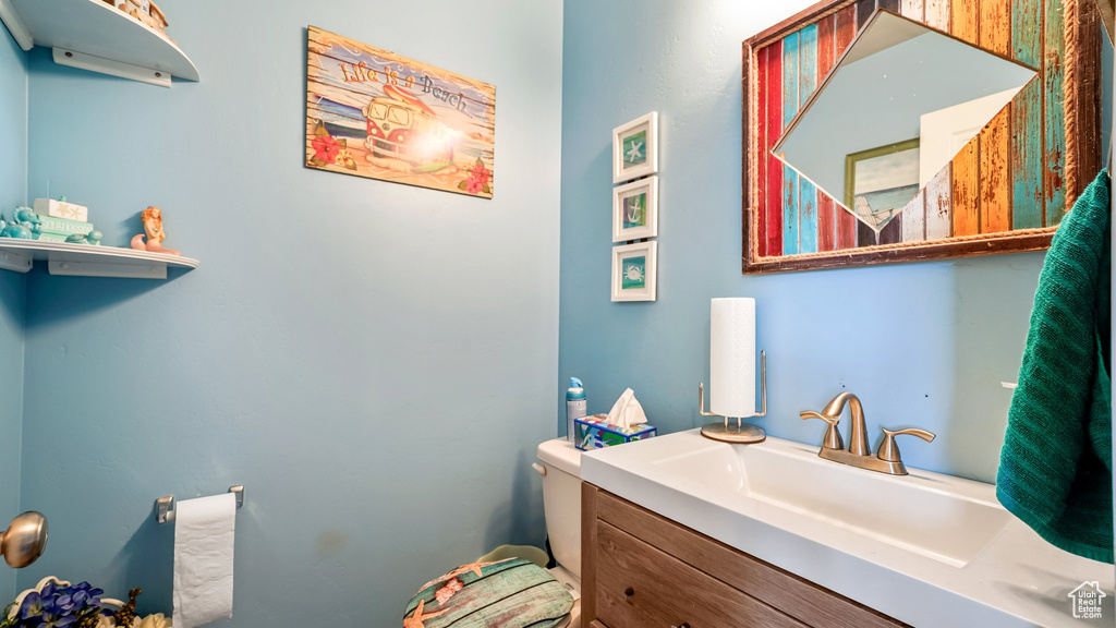 Bathroom with vanity and toilet