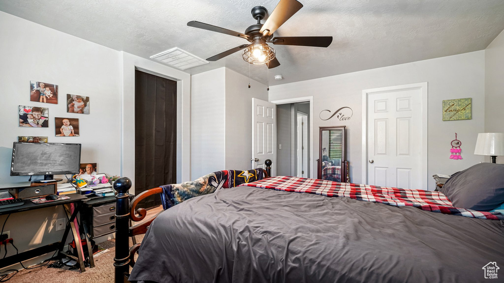 Bedroom featuring carpet floors and ceiling fan