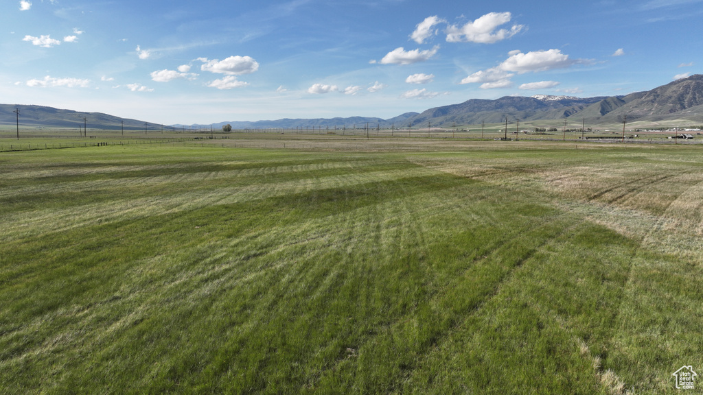 View of mountain backdrop featuring rural landscape