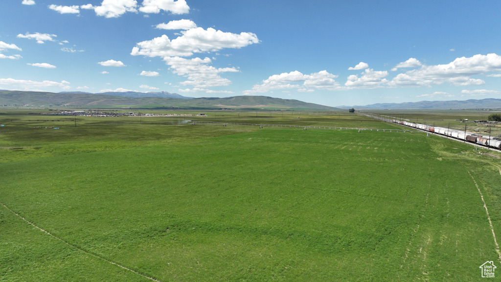 View of mountain backdrop featuring rural landscape and a pastoral area
