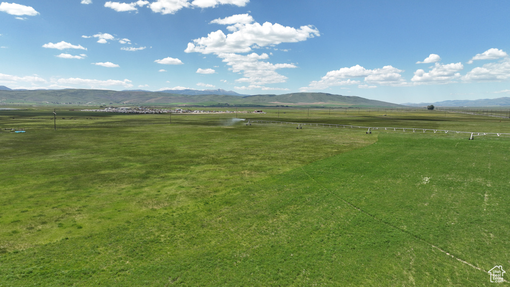 View of mountain background featuring rural landscape and agricultural land