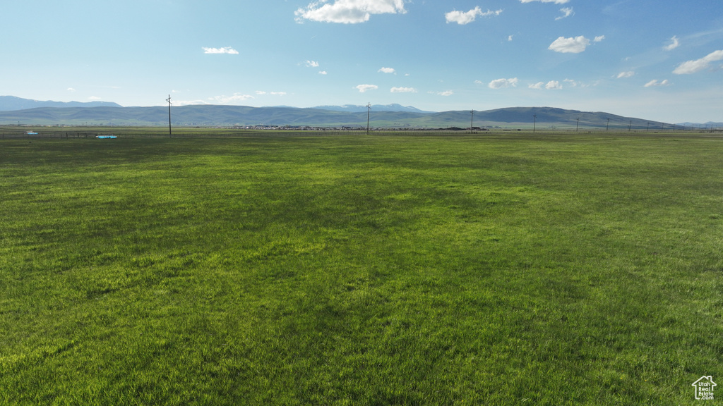 View of mountain backdrop with rural landscape and a pastoral area