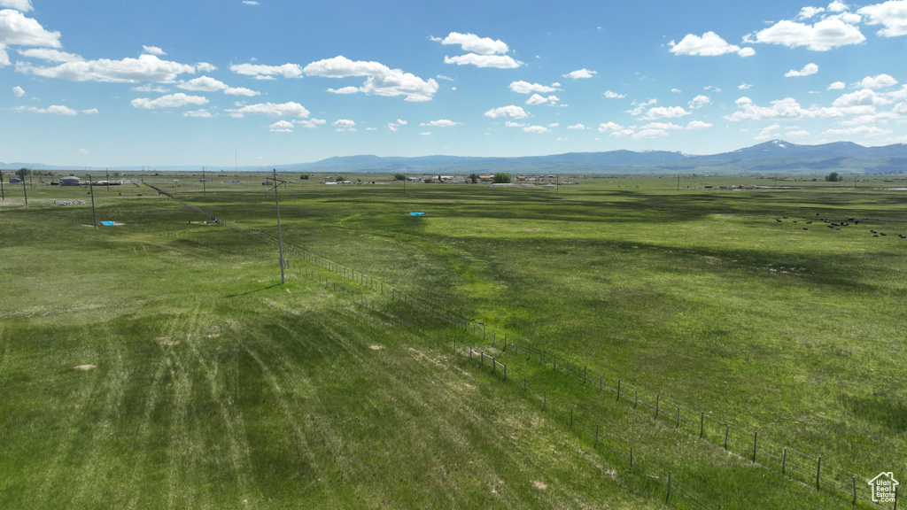 View of mountain backdrop with rural landscape