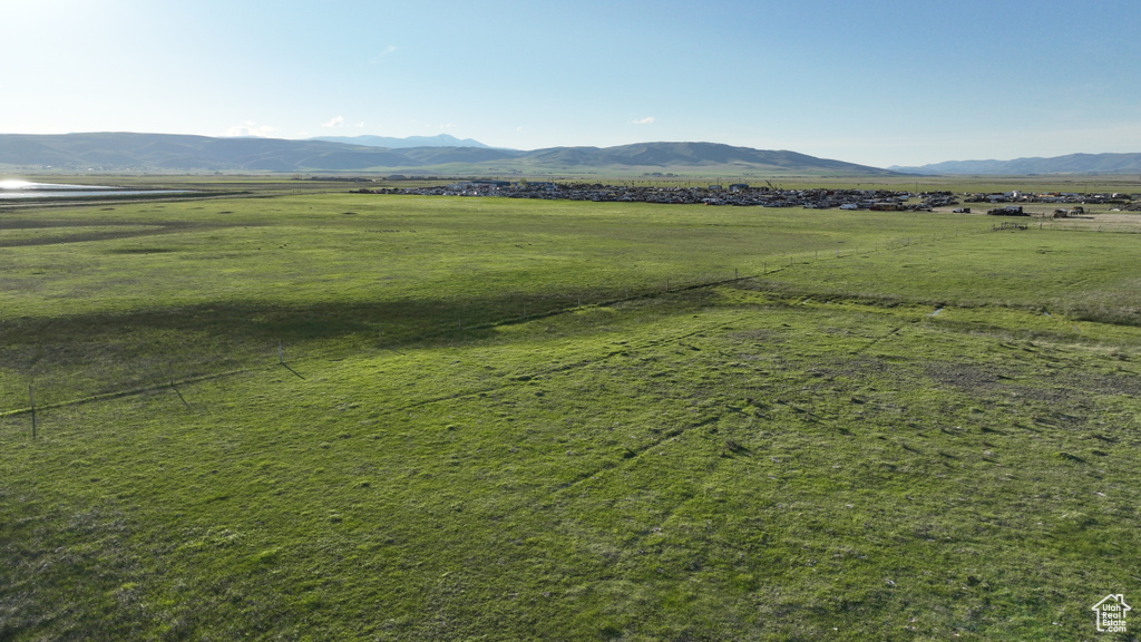 View of mountain backdrop with rural landscape