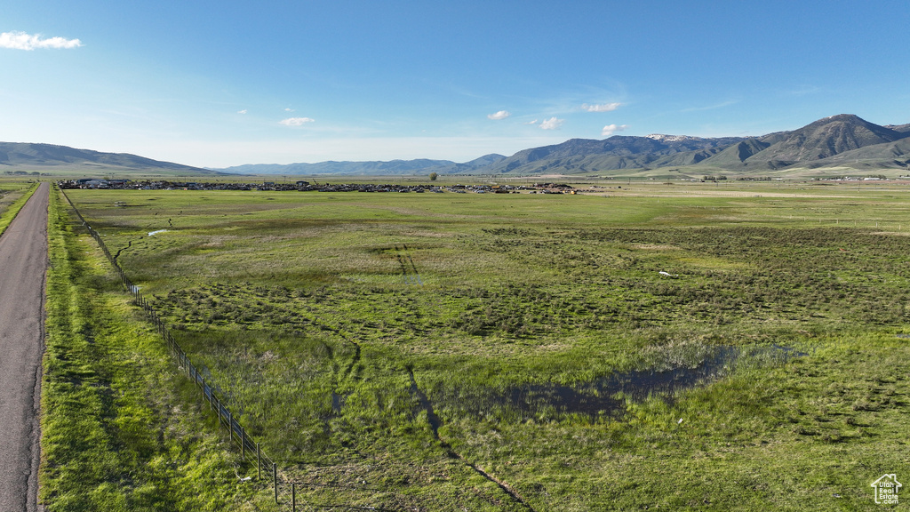 View of mountain backdrop featuring rural landscape