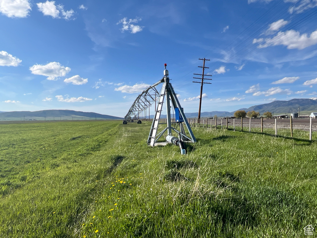View of yard with a mountain view and a view of rural / pastoral area