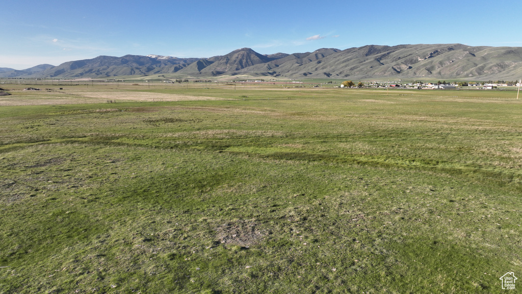 View of mountain background featuring rural landscape