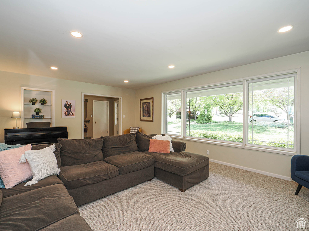 Living room with recessed lighting, baseboards, and carpet floors