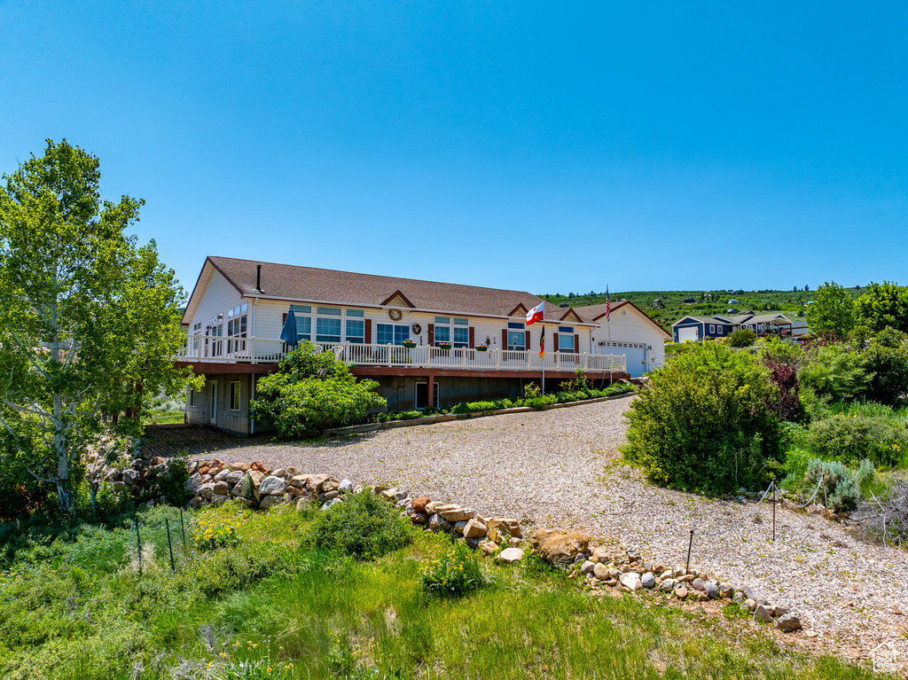 Rear view of property with a wooden deck