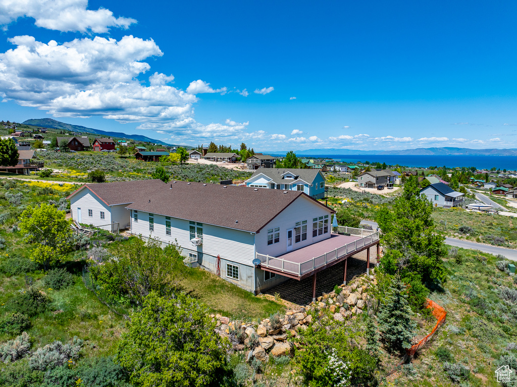 View of subject property with mountains