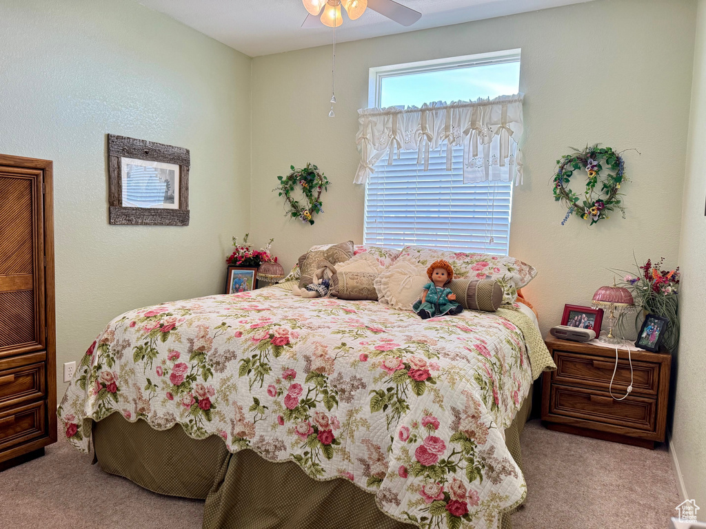 Bedroom featuring carpet flooring and ceiling fan