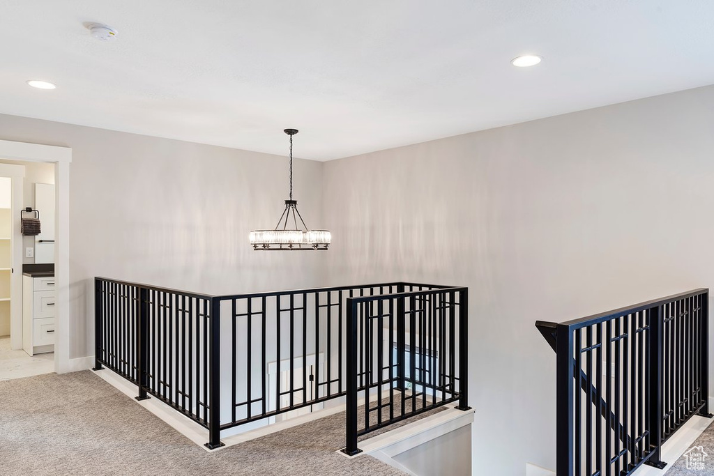 Stairway with a chandelier, recessed lighting, carpet floors, and baseboards