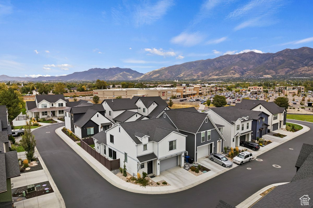 Aerial perspective of suburban area featuring a mountainous background
