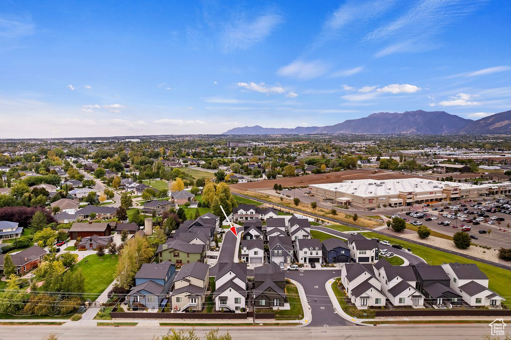 Aerial view of residential area featuring a mountain backdrop
