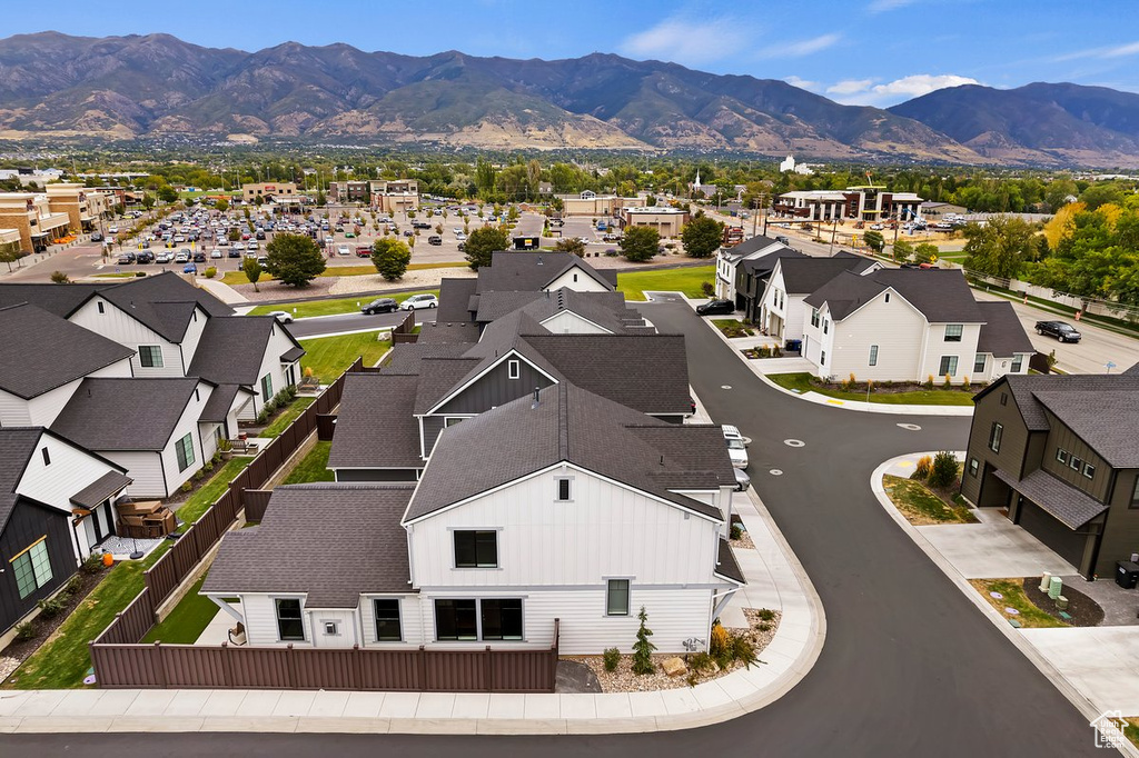 Aerial perspective of suburban area with a mountainous background