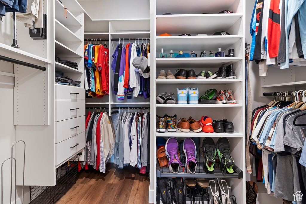 Spacious closet featuring wood finished floors