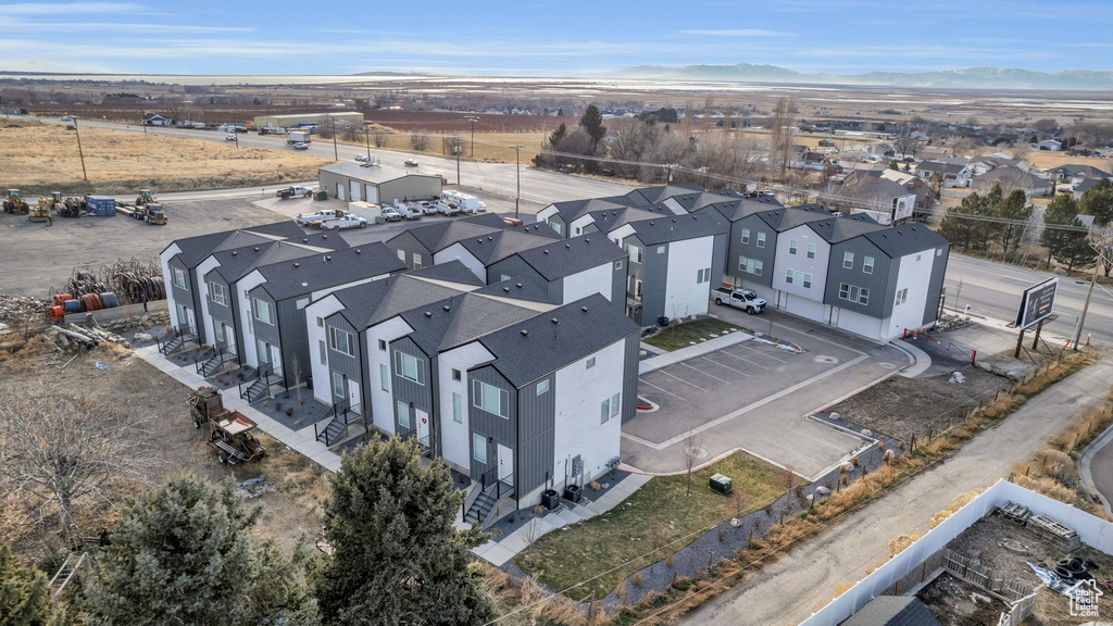Aerial view of residential area featuring mountains