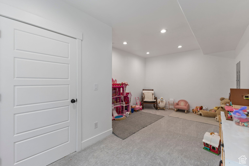 Rec room with carpet floors, recessed lighting, and baseboards