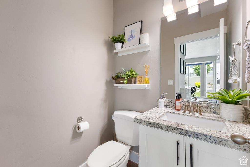 Bathroom with toilet and vanity