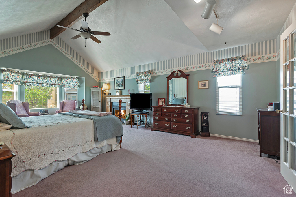 Carpeted bedroom featuring baseboards and ceiling fan