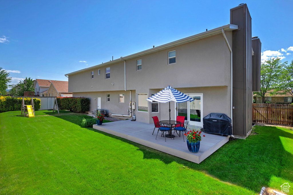 Back of property featuring stucco siding and a patio area